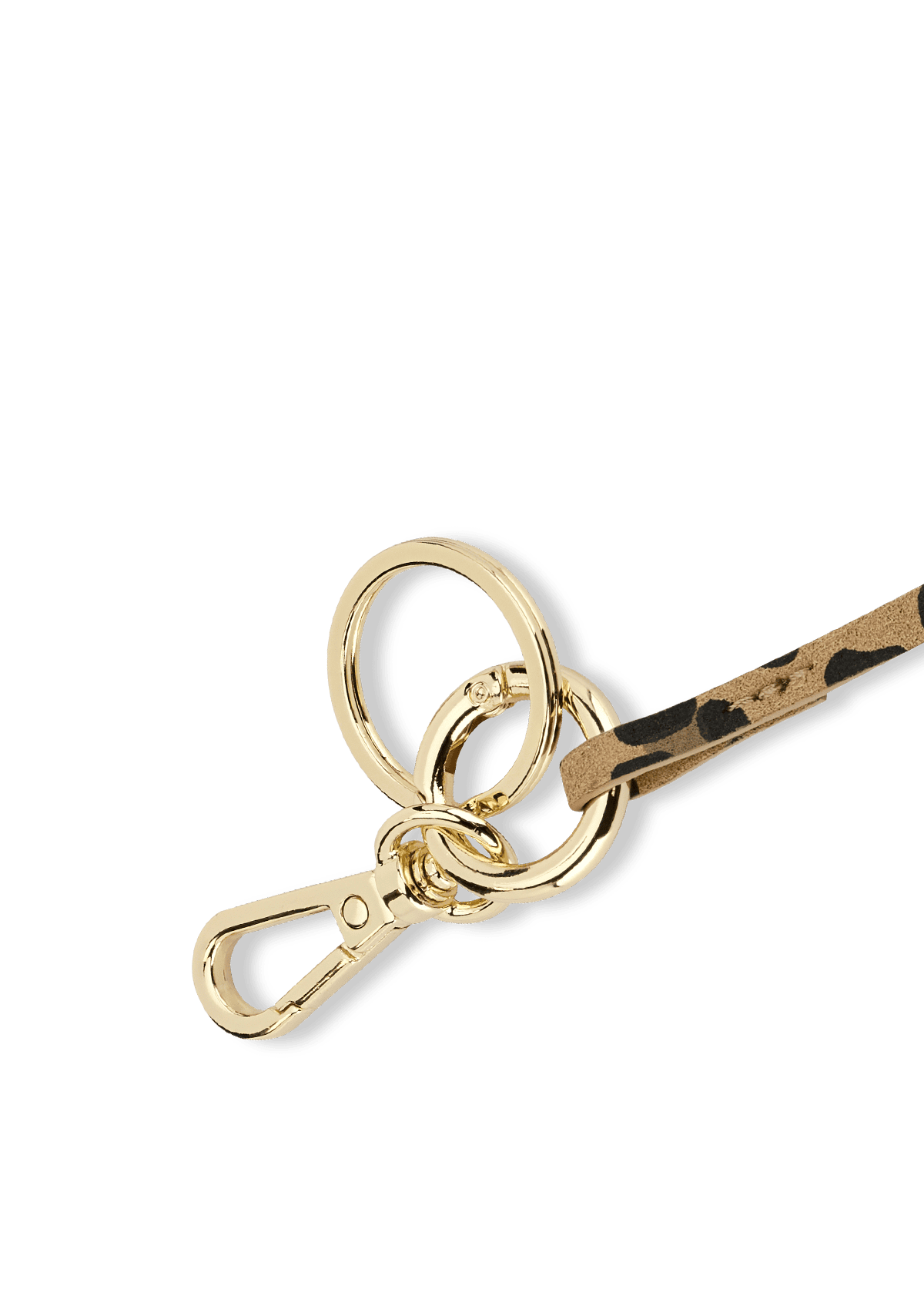 Seitenansicht auf neutralem Hintergrund des Produktes Heart Tassle Charm in der Farbe Leo Sand