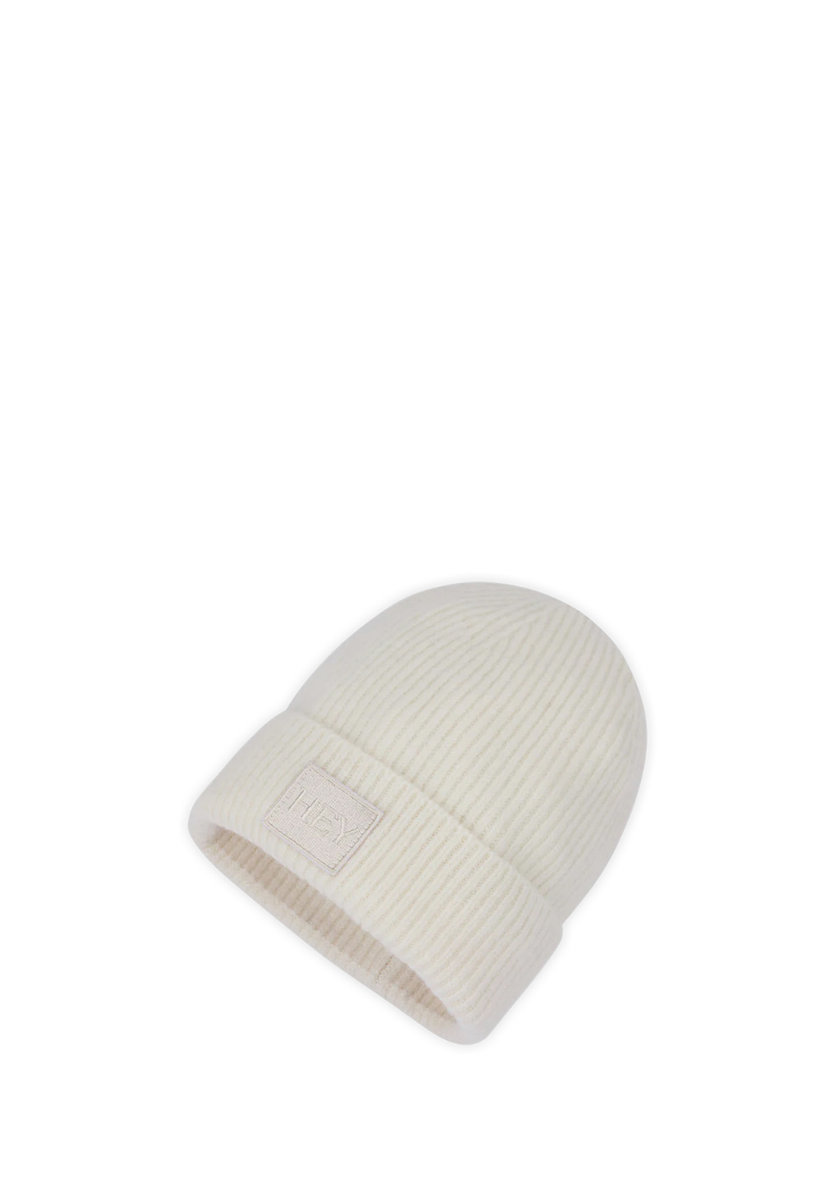 Seitenansicht auf neutralem Hintergrund des Produktes Hey Beanie in der Farbe Crema
